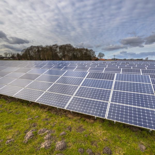 Solar power panels ,Photovoltaic modules for innovation green energy for life with blue clouded sky background.